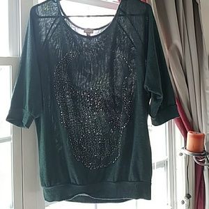 Green and black skull shirt.